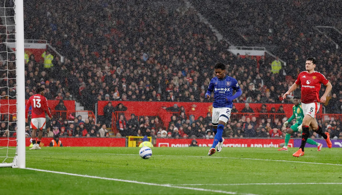  Philogene scoring open goal against Manchester United